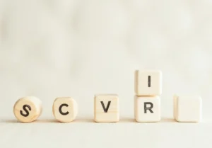 a wooden block with the word cvr spelled in black on top of it